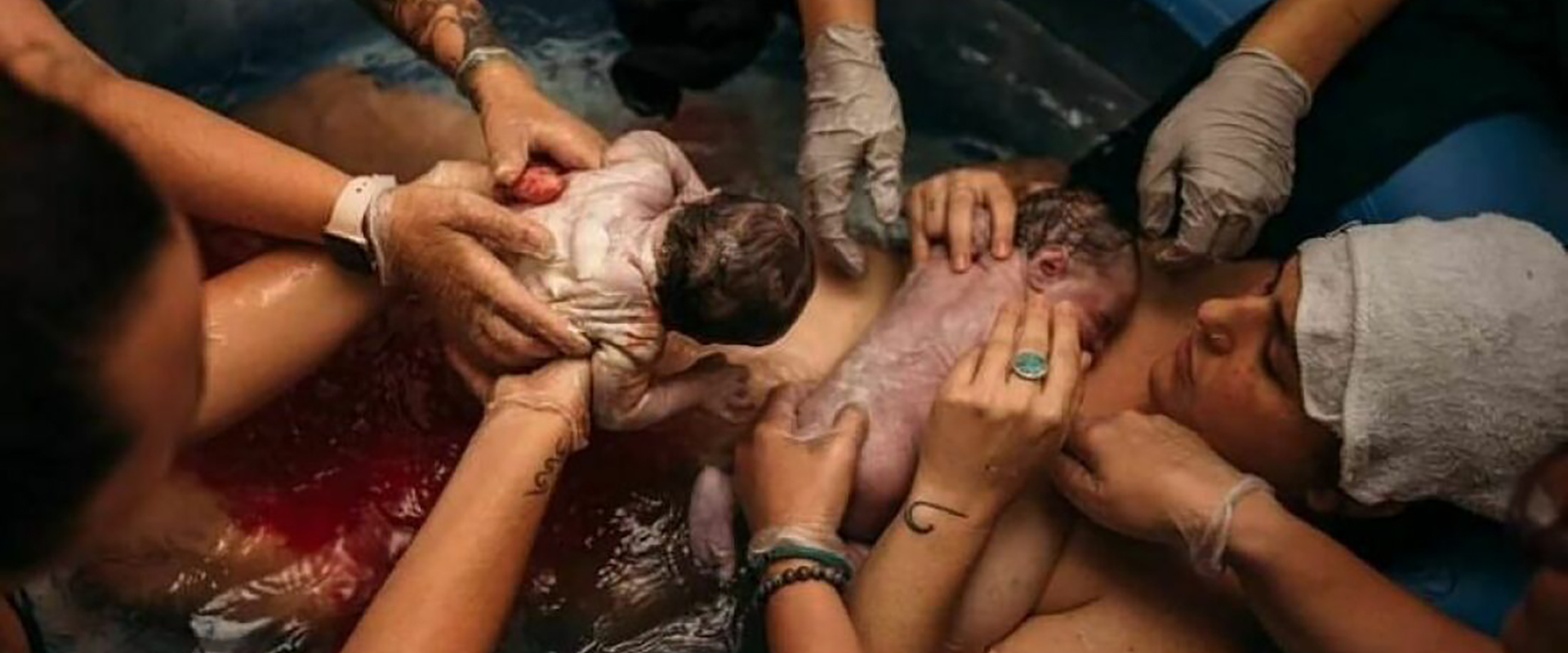 Adult hand holding a child's hand